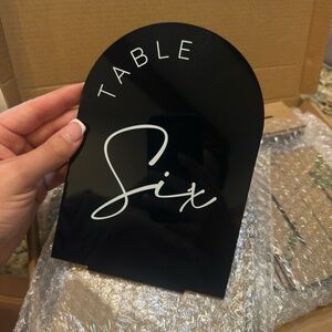 Black Table Sign with White Lettering